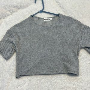 Sized small but fits a little baggy, almost a sweater-like material